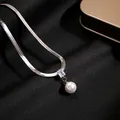 Detail shot of silver snake chain necklace featuring rectangle zircon and white pearl - Silver Square Zircon Pearl Necklace