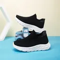 Kids black knit sock sneakers with breathable fly-knit upper and white cushioned sole - EU 28 / Black and White