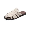 Chic cream woven leather flat mules with a minimalist retro design on white background - EU 34 / Apricot
