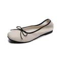 Classic ballet flats with square toe, beige leather texture, and black bow detail - EU 35 / Apricot