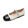 Classic two-tone Mary Jane flats with black patent toe, white body, and pearl chain strap - EU 34 / White