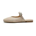Champagne gold pointed mule flats with shimmering rhinestone buckle and marble texture - EU 35 / Apricot