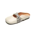 Elegant cream square-toe mule flats featuring a black and white floral fabric strap - EU 35 / Apricot