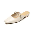 Elegant beige square-toe mule flats featuring gold stud straps and buckle detail - EU 35 / Apricot