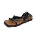 Women's black platform slide sandals with twisted leather straps and brown insoles - EU 35 / Black