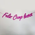Close-up of glittery rose red Feliz Cumpleaños birthday banner with shimmering texture - Glitter Rose Red
