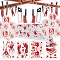 Macro shot of Halloween blood splatter tablecloth with bloody knife and tool banners - T2 Bloody Knife Tablecloth Caution Tape Balloon Set