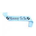 Detail of light blue satin Mommy To Be sash with black lettering and baby footprints - Sky Blue Mommy To Be