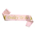 Detailed view of pink satin sash featuring gold glitter Daddy To Be text and footprints - Light Pink Daddy To Be