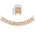 Macro detail of God Bless burlap banner with pink cross for baptism party decoration - Pink