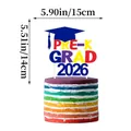 Colorful PRE-K GRAD 2026 cake topper with blue graduation cap and white sticks - Pre-K Graduation Large Style