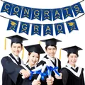 Detail of blue and gold Congrats Grad banner with glitter letters and graduation cap icon - Blue Graduation Banner