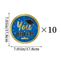 Detail of 7-inch graduation paper plates with You Did It gold text and graduation cap - Blue Gold Graduation Theme Small Paper Plate