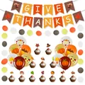 Macro detail of Thanksgiving party kit with GIVE THANKS banner and pumpkin cake toppers - Thanksgiving Dot Garland Cupcake Toppers and Balloons Set