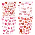 Close-up of four Valentine's Day popcorn boxes with heart patterns and Love text - Valentine's Day Style A
