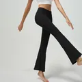 High-waisted black flare yoga pants in elastic nude-feel fabric for fitness workouts - S / Black
