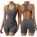 Seamless backless yoga bodysuit in dark grey with hollow-out back design and padded bra - S / Jumpsuits / Volcanic Gray