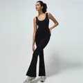 Women's black seamless flared yoga jumpsuit with a supportive U-neck and sleek design - S / Black