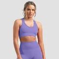 Women's purple seamless knit yoga set featuring cross-back sports bra and leggings - S / Tops / Purple