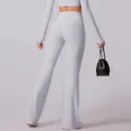 Yoga-Set mit High-Waist Schlaghose und bauchfreiem Langarm-Top in hellem Purpurgrau - S / Buchenweiß