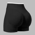 High-waisted black yoga shorts with white waistband and lifting back seam detail - L / Bottoms / Black
