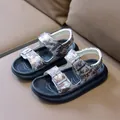 Detail view of boys camouflage sandals with adjustable metal buckles and ergonomic footbed - Size 25 (16cm) / Brown