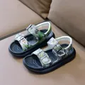 Detail of boys camouflage sandals featuring adjustable double straps and thick durable soles - Size 21 (14cm) / Green