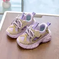 Detail showing breathable purple mesh upper and beige Velcro strap on kids' sneakers - EU 21 / Purple