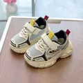 Close-up of children's mesh sneakers featuring breathable fabric and fashion branding - EU 22 / Black