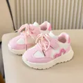 Detailed view of pink and white kids' sneakers with velcro straps and thick rubber soles - Size 21 (13.5cm) / Pink
