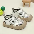 Detailed macro view of breathable mesh texture and anti-collision closed toe for kids sandals - EU 21 / Black
