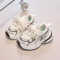 Detail view of breathable mesh kids sneakers with Velcro straps and thick anti-slip soles - EU 21 / Beige