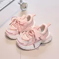 Detailed close-up of pink breathable mesh fabric and durable sole on children's sneakers - EU 21 / Pink