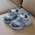 Grey and blue breathable mesh kids' sneakers with non-slip thick soles on leather sofa - EU 21 / Silver