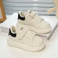 Kids cream leather sneakers with black heel accent and secure hook and loop closure - EU 21 / Black