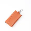 Orange lychee grain leather key pouch with silver swivel lobster clasp and stitching - Orange