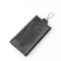 Classic dark brown leather key pouch with metal hook and pebble grain texture - Dark Coffee