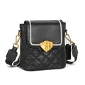 Litchi pattern leather bucket bag with diamond quilting and wide woven shoulder strap - Black
