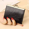 Portacarte vintage in pelle cerata nera con chiusura a scatto in metallo dorato - Nero