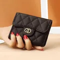 Quilted black caviar leather mini wallet with gold hardware and snap flap closure - Black