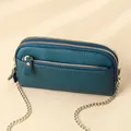 Minimalist teal leather crossbody bag with three zipper layers and golden chain - Teal
