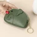 Green leather elephant coin purse with zipper and golden keychain hanging on hands - Green