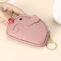 Pink pebble leather mini elephant coin purse with golden keychain held in hand - Pink
