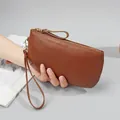 Brown litchi grain genuine leather wristlet purse with gold zipper and hand strap - Brown