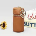 Mini pochette marron en cuir grainé avec fermeture éclair dorée et porte-clés - Jaune Terre