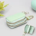 Mint green pebble leather car key case with double zippers and gold hardware clips - Avocado Green