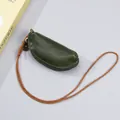 Mini pochette in pelle verde scuro con cordino e cerniera metallica vintage - Verde