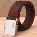 Detail of outdoor canvas tactical belt with silver metallic buckle and woven nylon texture - 120cm / Brown