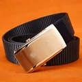 Navy blue nylon tactical belt with brushed golden lion buckle on orange backdrop - Silver Buckle - Royal Blue