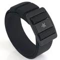 Black nylon tactical stretch belt with a textured star-patterned buckle design - Black